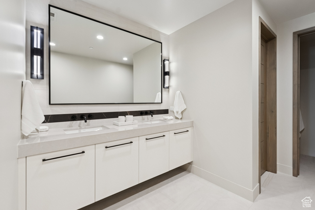 Bathroom featuring double vanity and recessed lighting