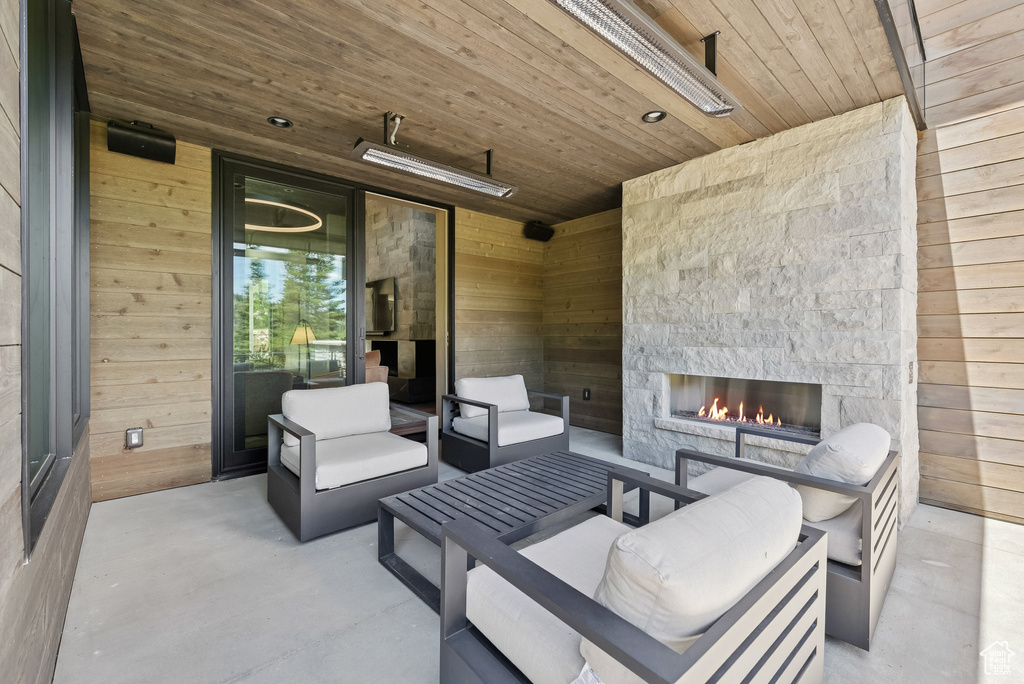 View of patio with a fireplace