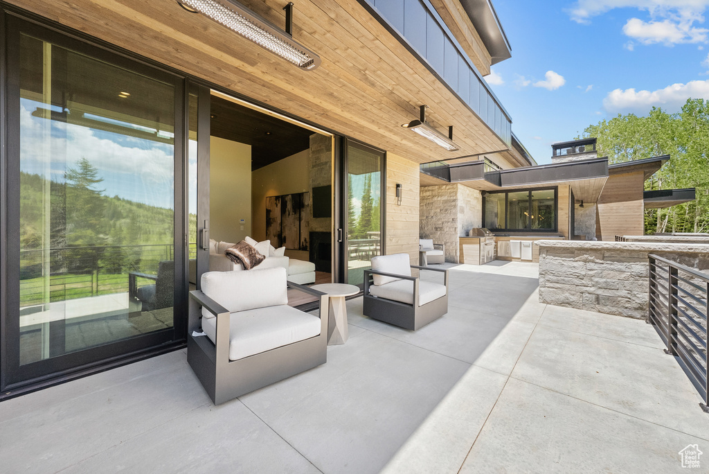 View of patio featuring exterior kitchen