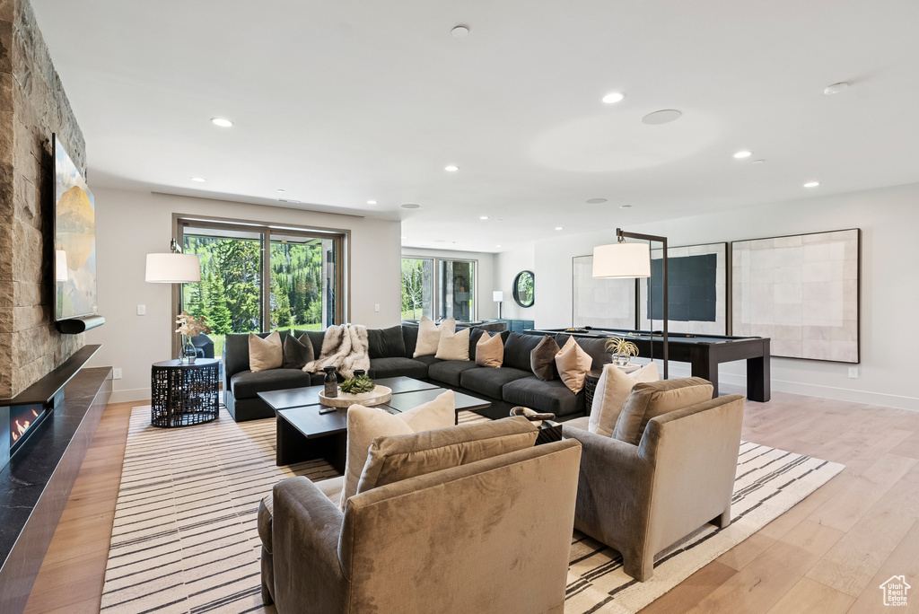 Living area featuring recessed lighting and light wood-type flooring