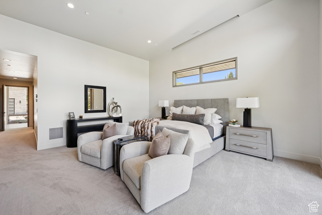 Bedroom featuring light carpet and recessed lighting