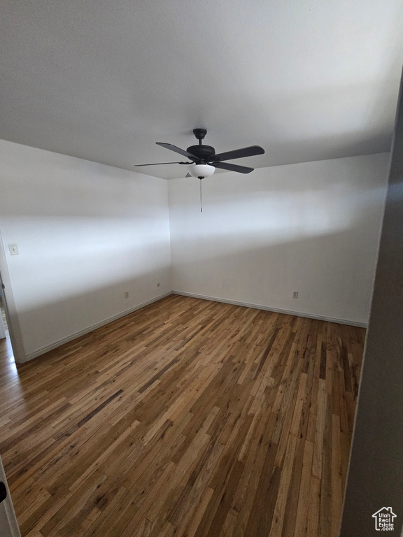 Spare room featuring wood finished floors and ceiling fan