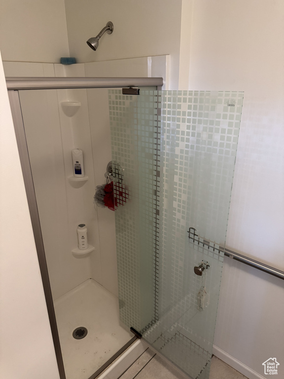 Full bathroom featuring a stall shower