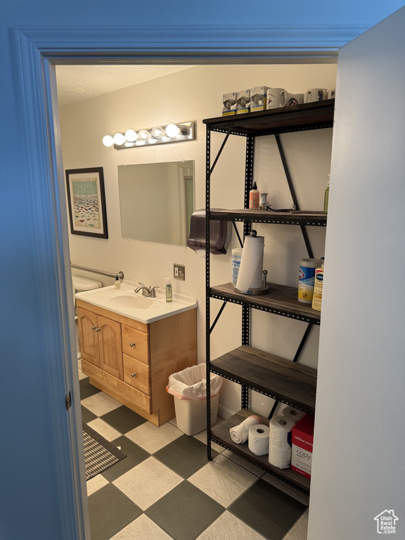 Bathroom featuring vanity and tile patterned floors
