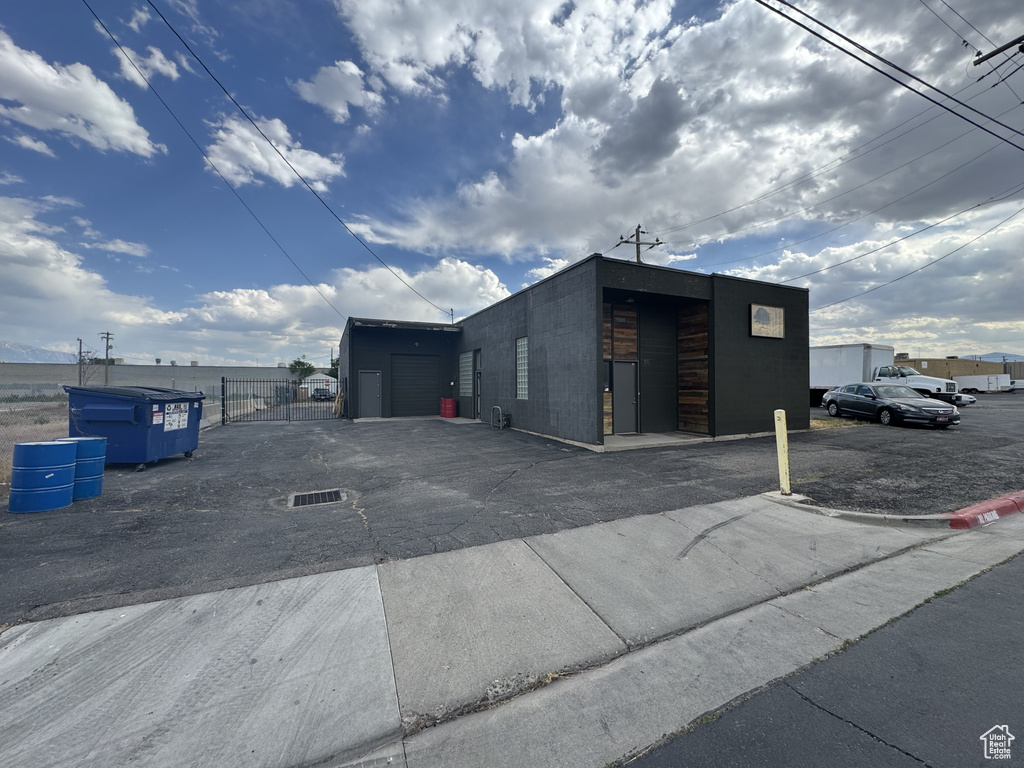 View of property with uncovered parking