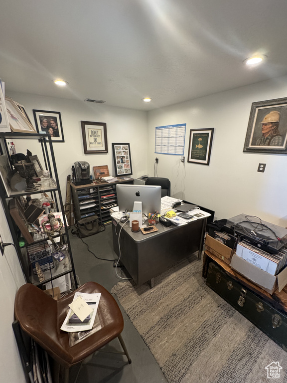Office area with finished concrete floors and recessed lighting
