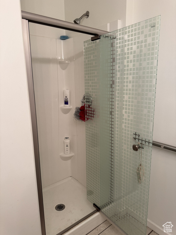 Full bathroom featuring a stall shower