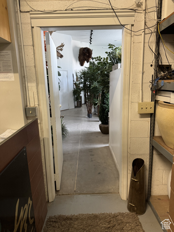 Corridor with concrete floors and concrete block wall