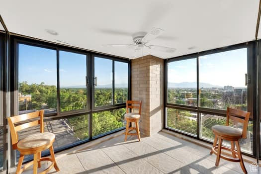 Sunroom / solarium featuring expansive windows