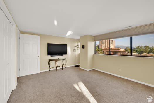 Unfurnished living room with carpet flooring