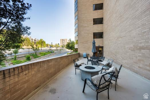 View of patio / terrace featuring an outdoor fire pit