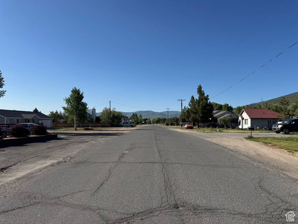 View of asphalt street with a mountain view