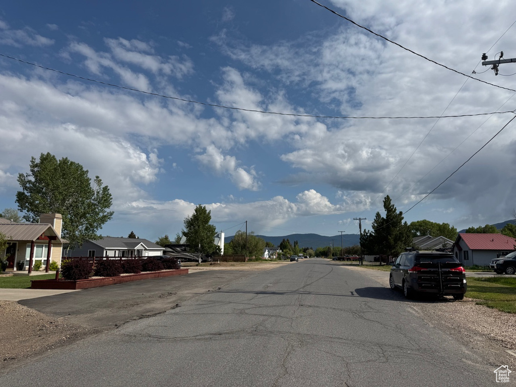 View of asphalt road with a mountain view and a residential view