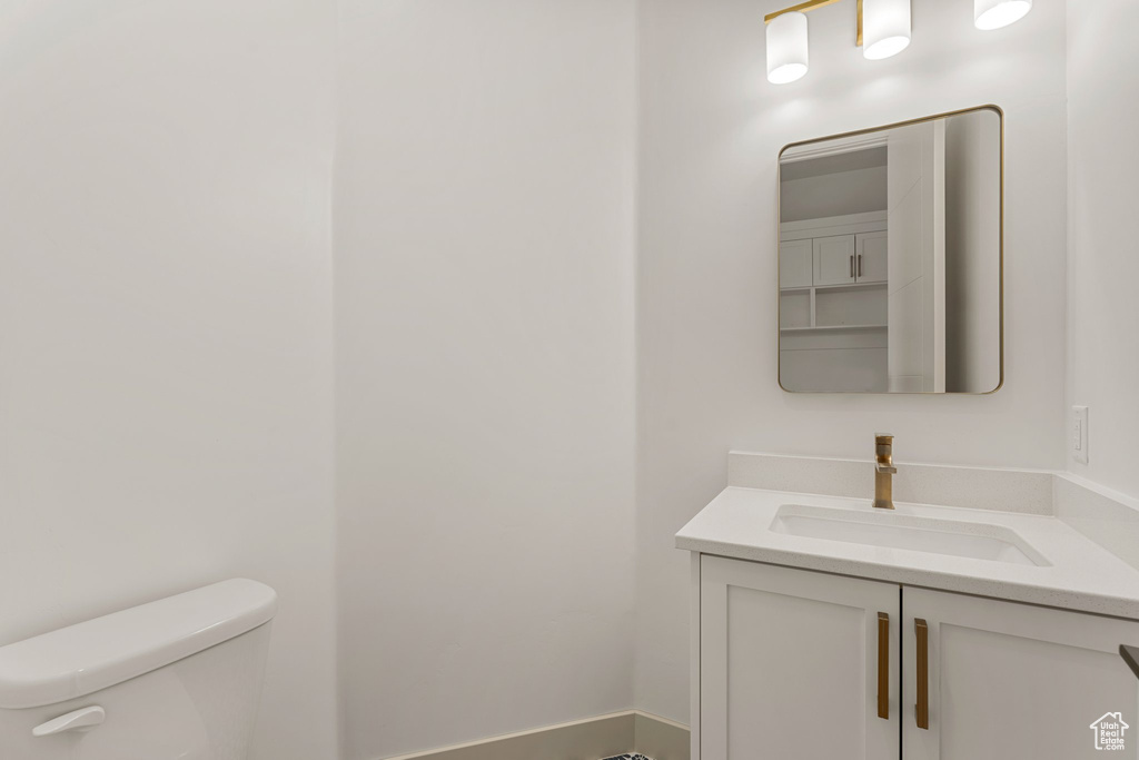 Bathroom with toilet and vanity