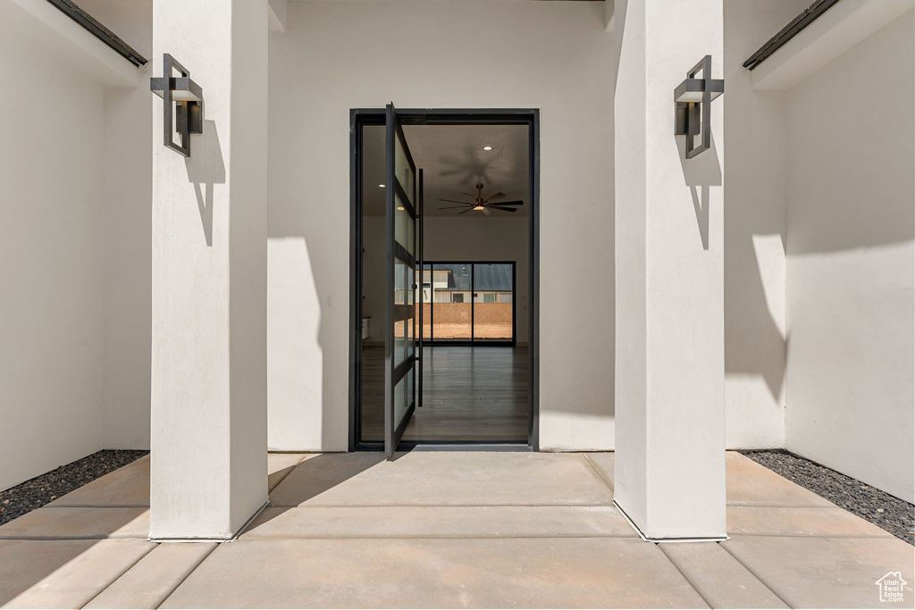 View of exterior entry with stucco siding