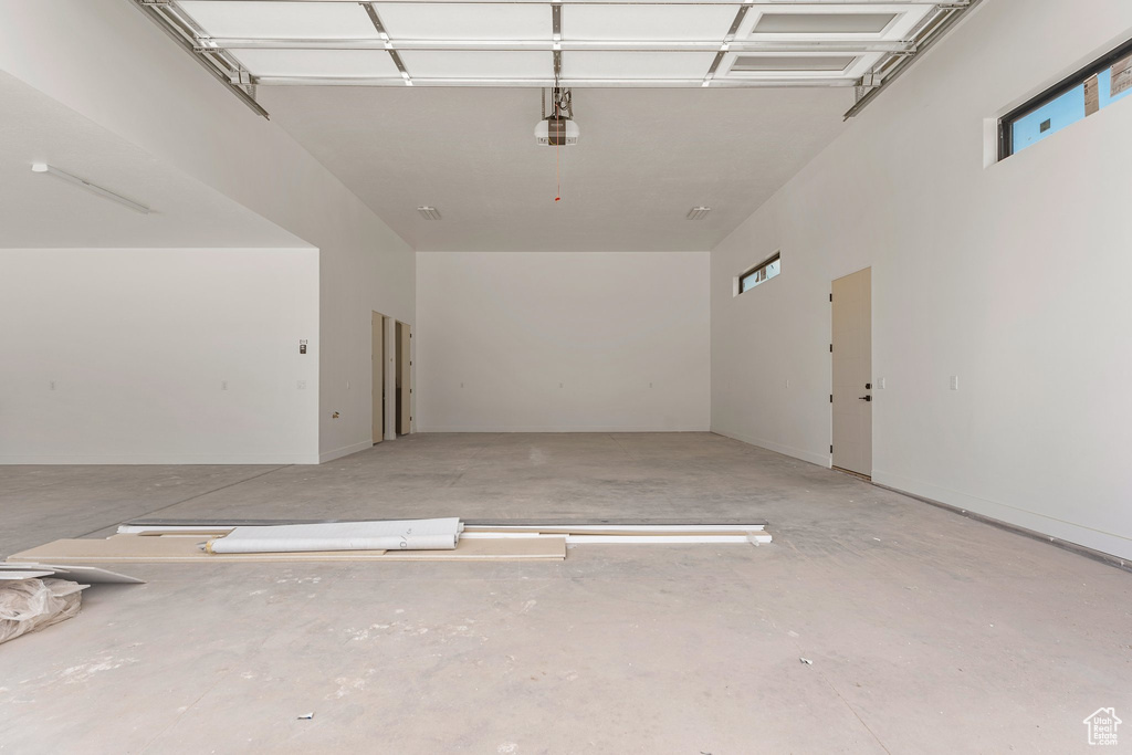 Garage featuring a garage door opener