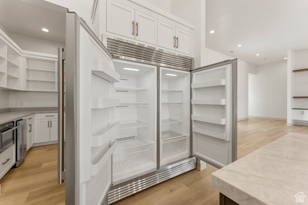 Pantry featuring wine cooler