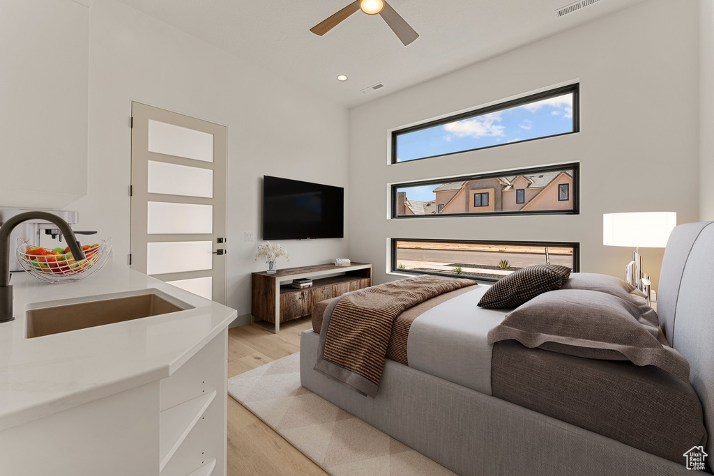 Bedroom featuring light wood-style floors and ceiling fan