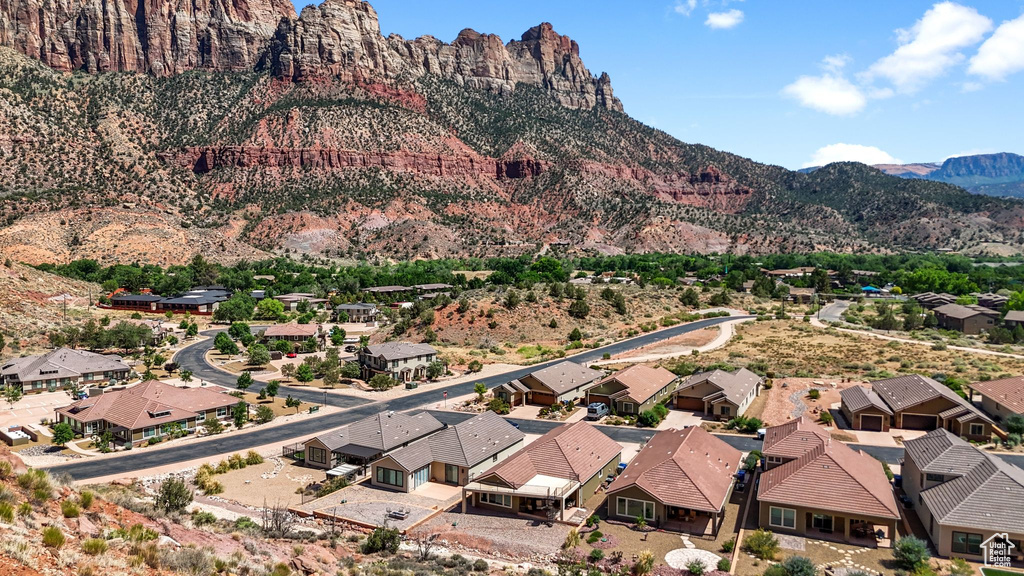 Aerial view of residential area featuring a mountain backdrop