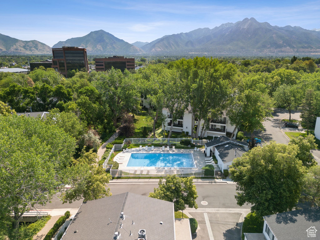 Aerial view of a pool area and a mountainous background