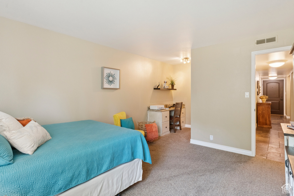 Bedroom with carpet and baseboards