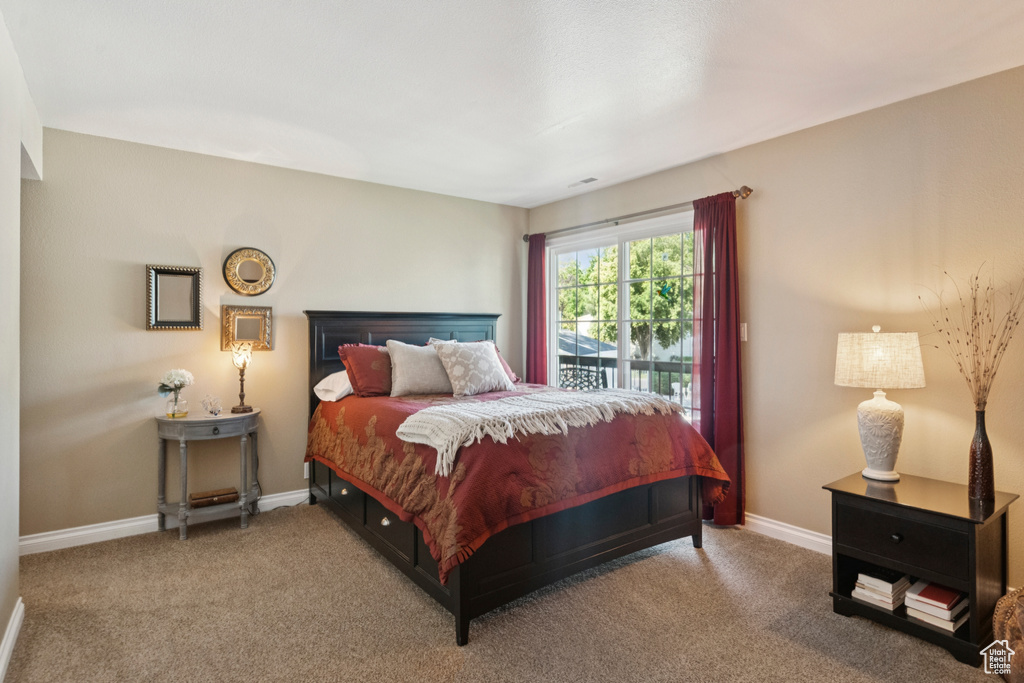 Bedroom featuring carpet floors and access to outside