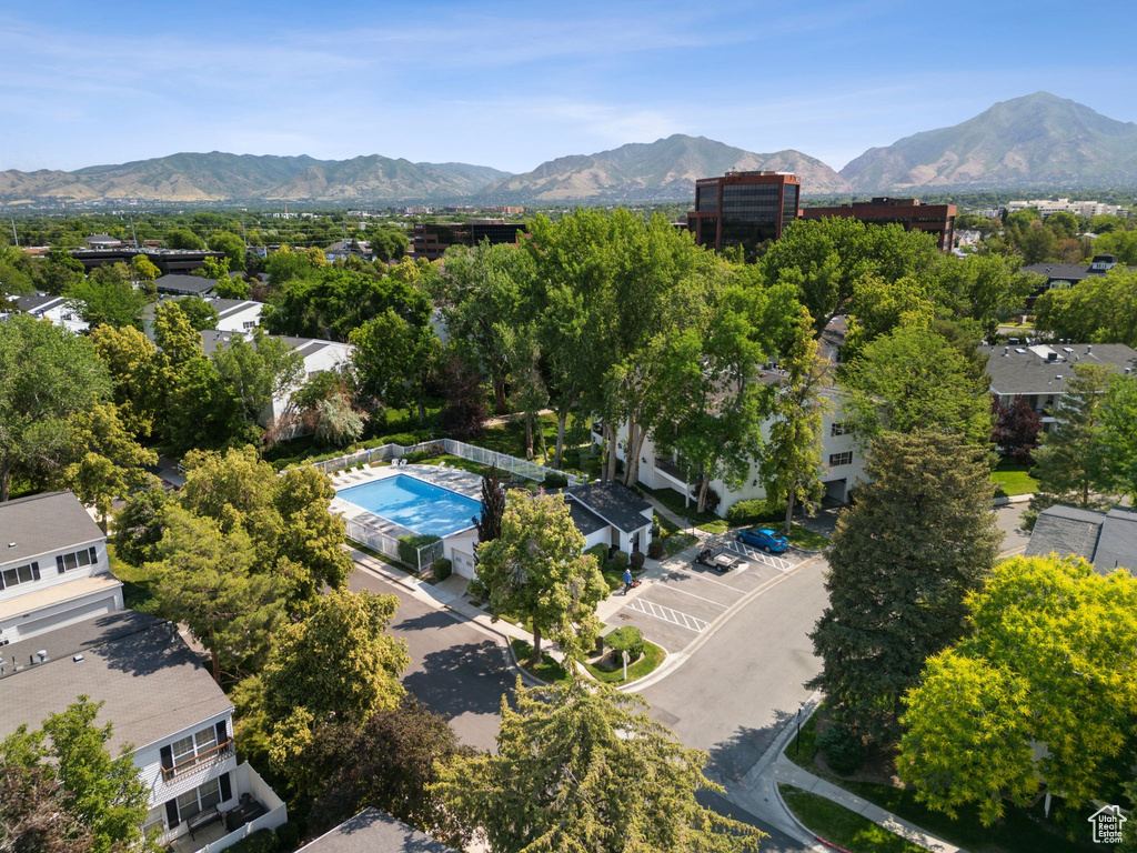 Aerial view of a mountain backdrop and a pool