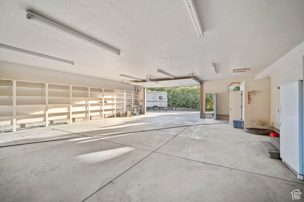 Garage with freestanding refrigerator