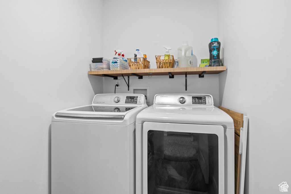 Laundry room featuring separate washer and dryer