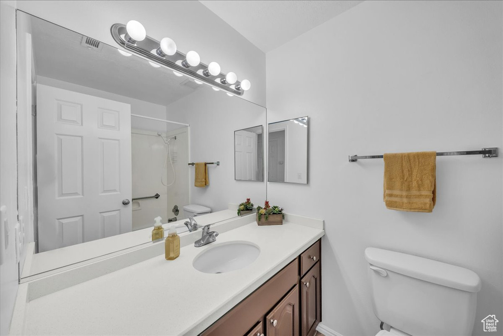 Bathroom with vanity and a shower