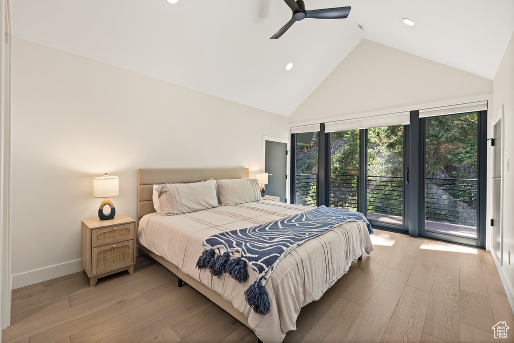 Bedroom with access to outside, high vaulted ceiling, light wood finished floors, recessed lighting, and a ceiling fan