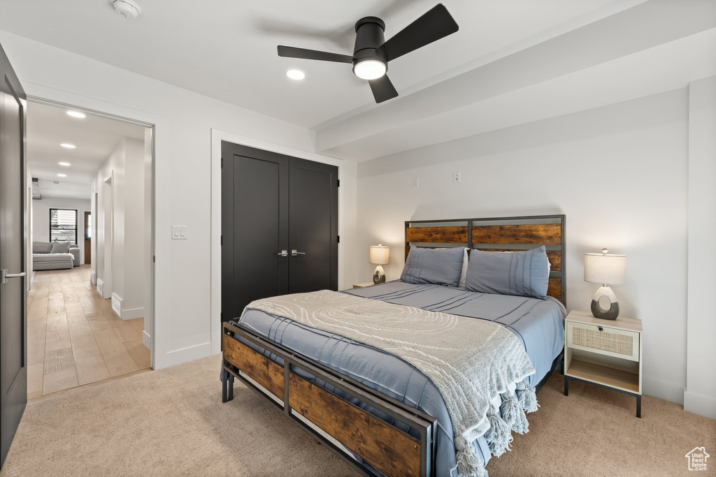Bedroom with recessed lighting, light carpet, a closet, and ceiling fan