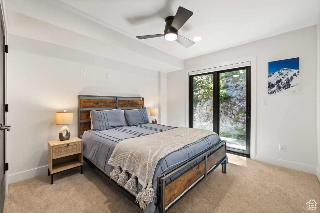 Bedroom featuring light colored carpet, access to exterior, a ceiling fan, and recessed lighting