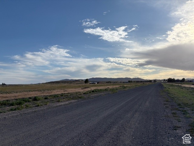 View of street featuring a rural view and a mountain view