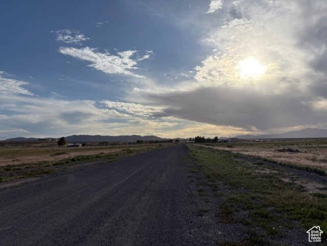 View of street with a mountain view and a view of rural / pastoral area
