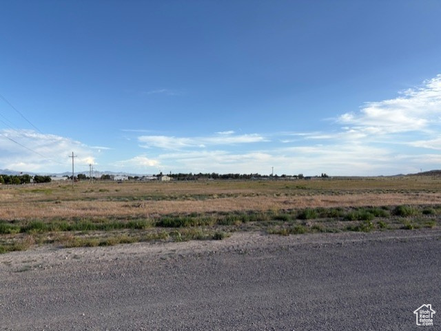 View of asphalt road with a rural view