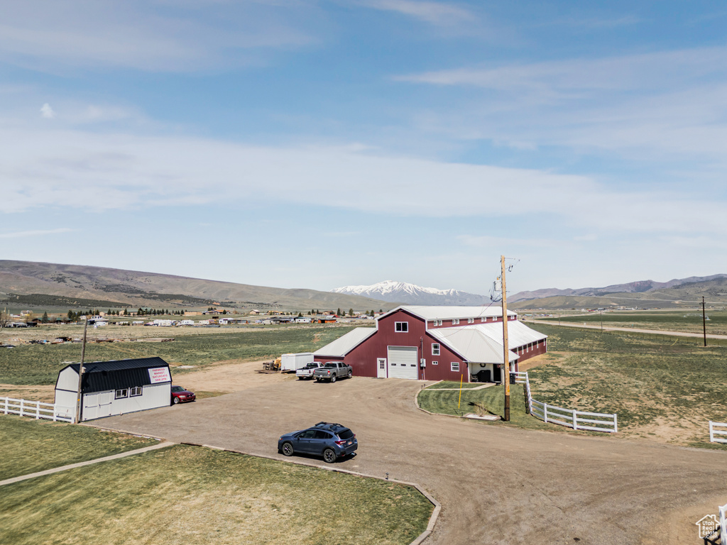 Overview of rural landscape featuring a mountainous background