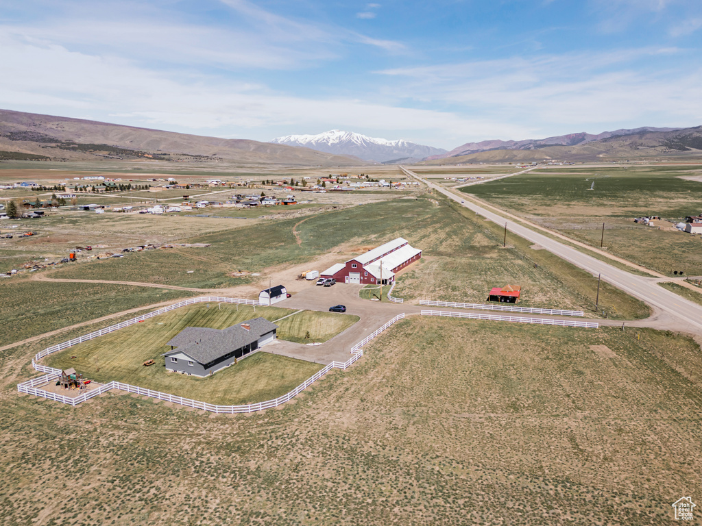 Aerial view of sparsely populated area featuring a mountain backdrop