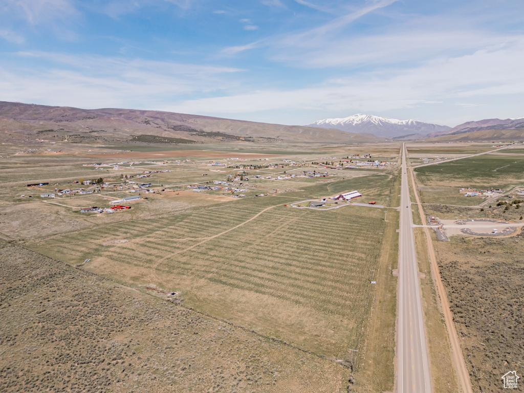 Overview of rural landscape featuring a mountainous background