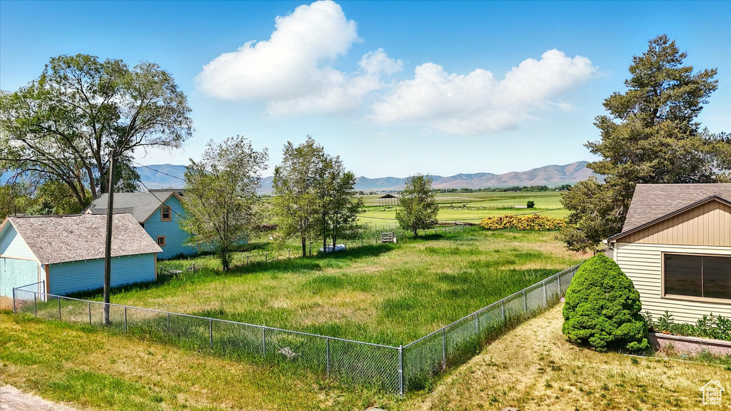 View of yard with a mountain view and a rural view