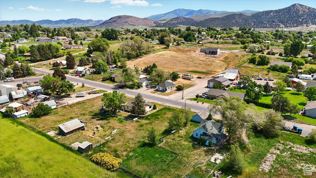 Aerial perspective of suburban area with a mountainous background