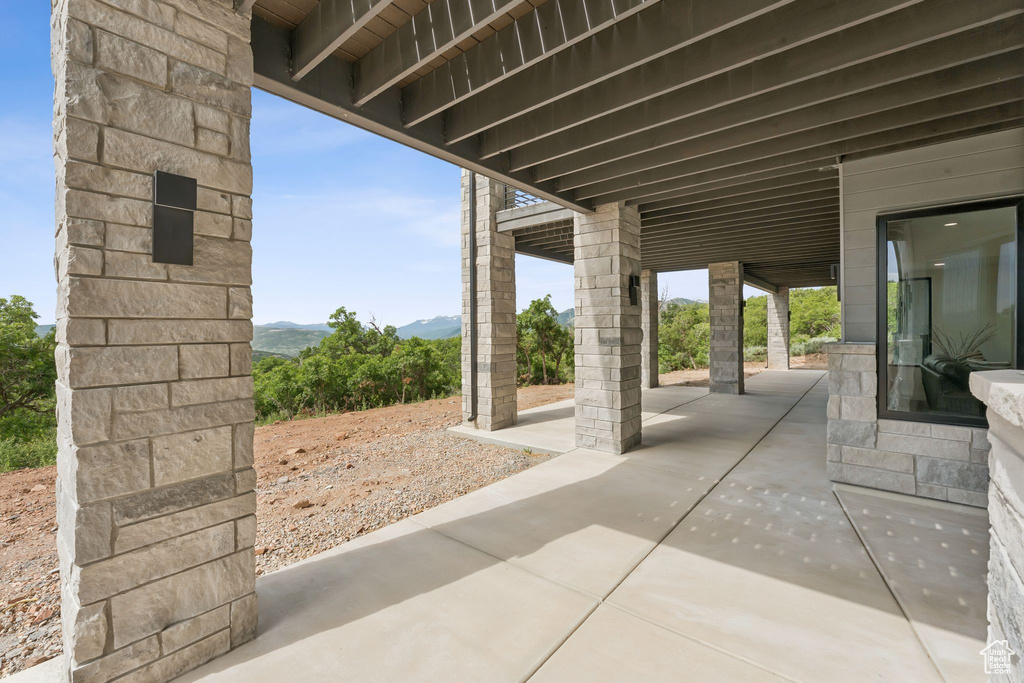 View of patio with a mountain view