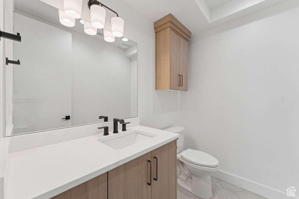 Bathroom with vanity and toilet