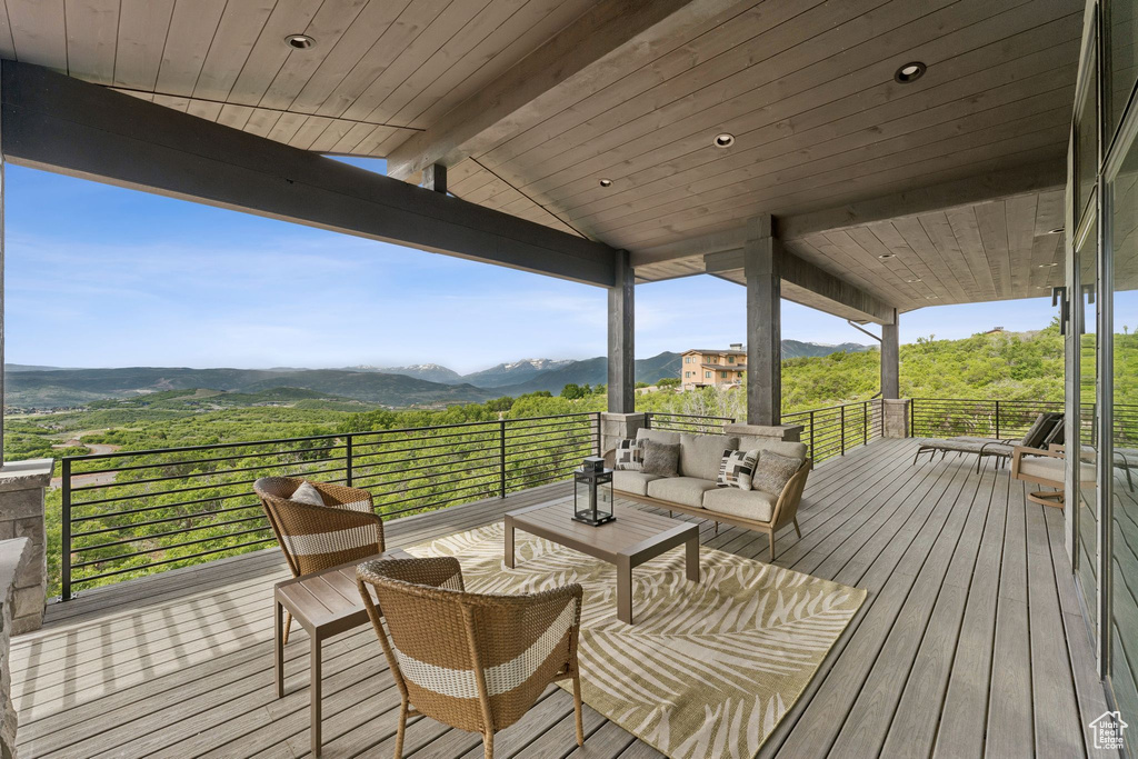 Wooden terrace with a mountain view and an outdoor hangout area