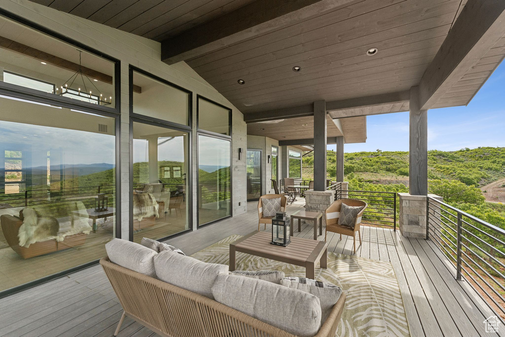 Wooden deck featuring an outdoor hangout area