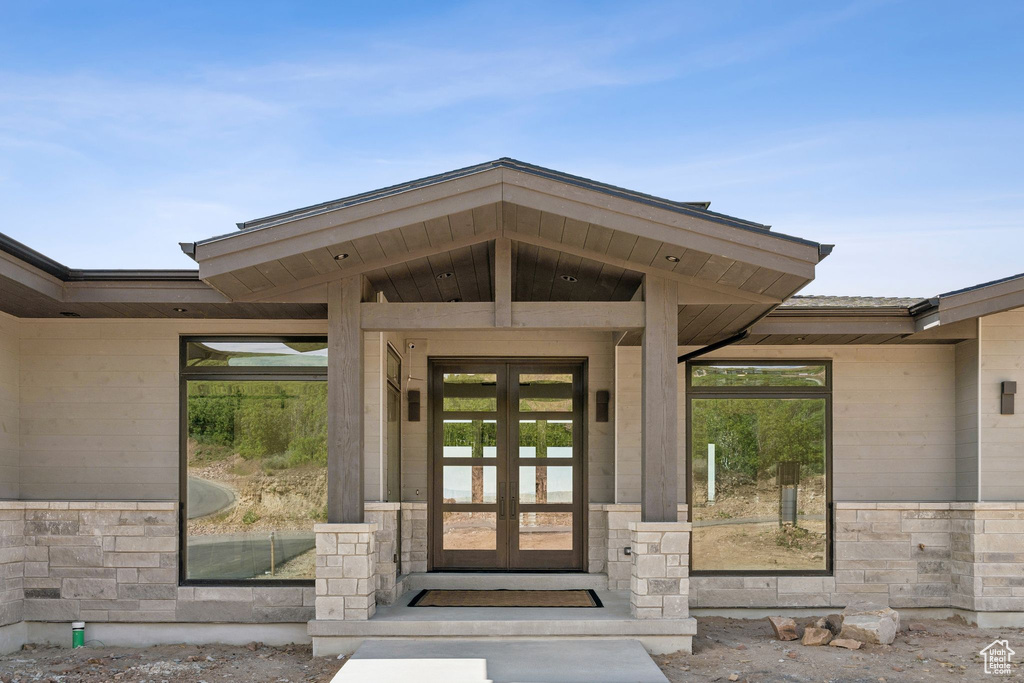 View of exterior entry featuring french doors