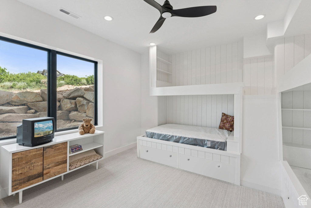 Carpeted bedroom featuring recessed lighting and ceiling fan