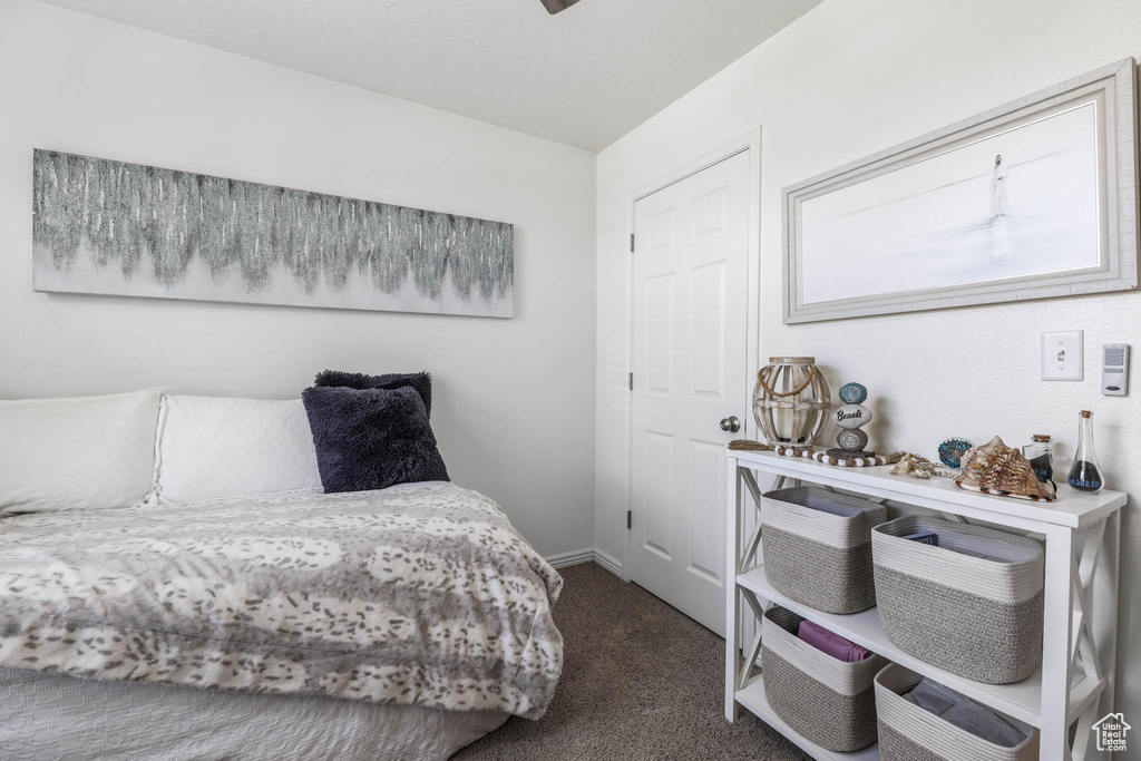 Carpeted bedroom featuring baseboards