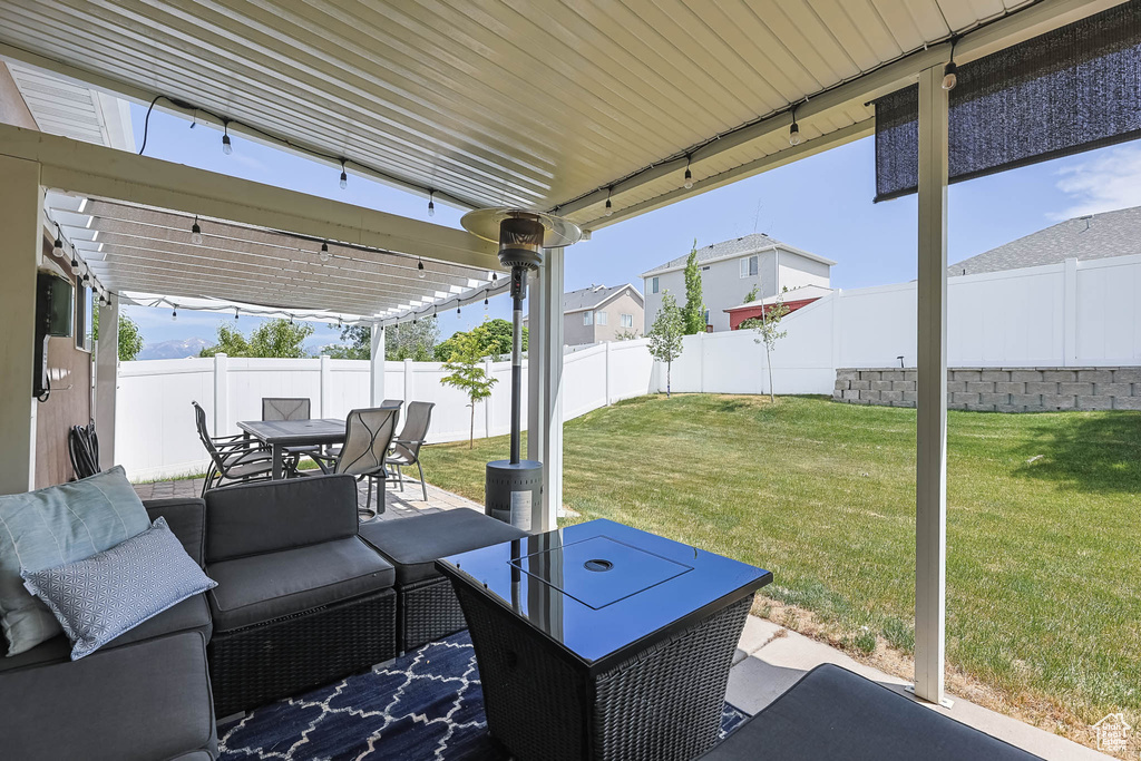 Fenced backyard featuring outdoor dining space, a patio, and outdoor lounge area