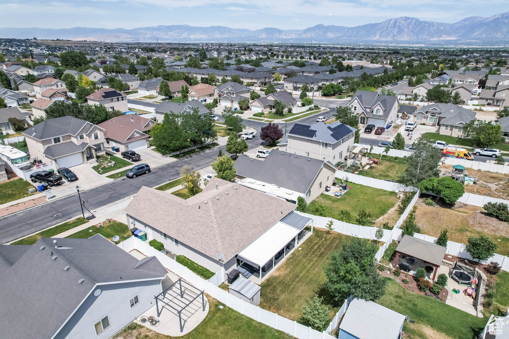 Aerial perspective of suburban area featuring a mountainous background